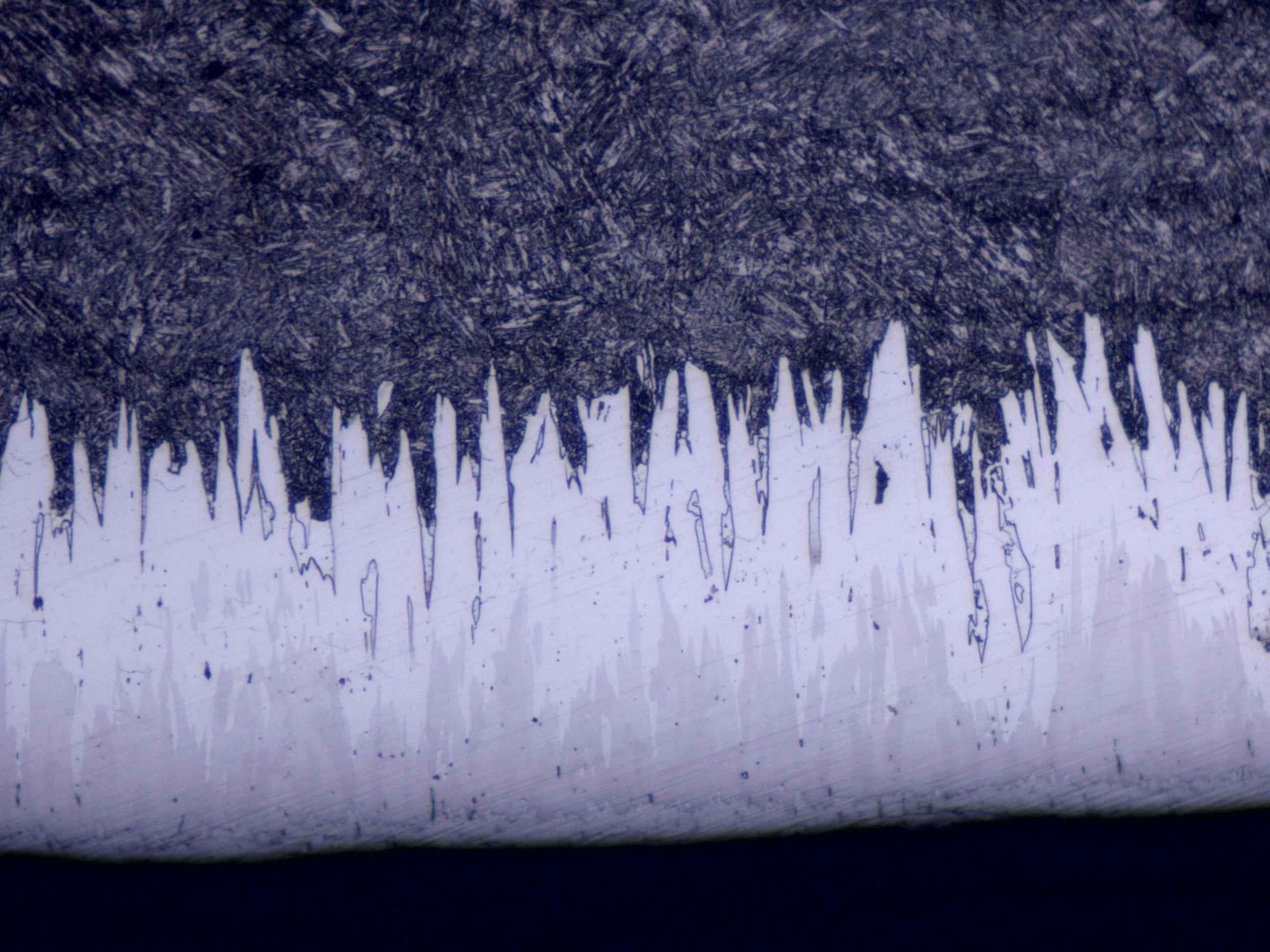 SEM cross-section of Fusion X treatment on N80 grade