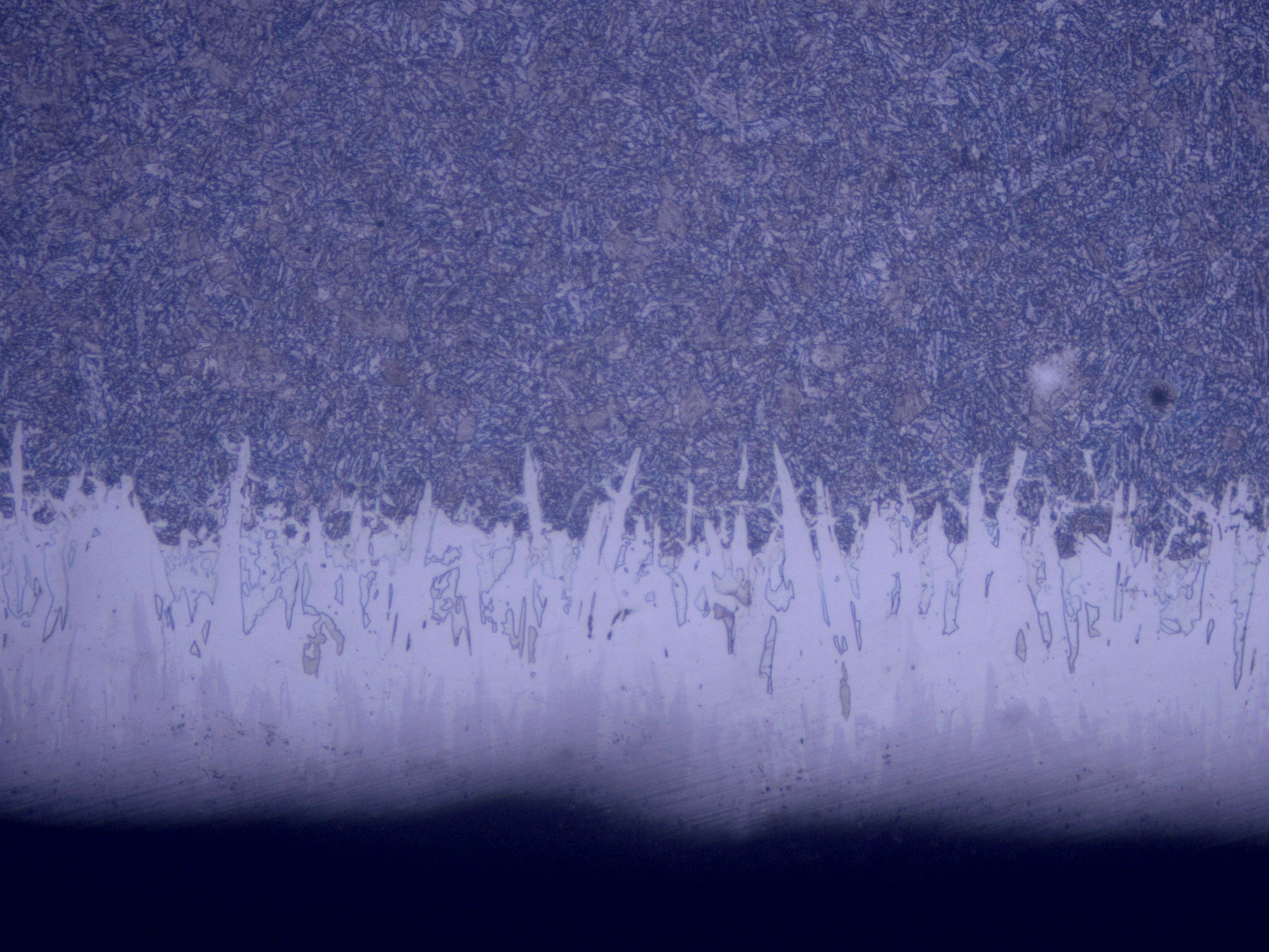 SEM cross-section of Fusion X treatment on P110 grade