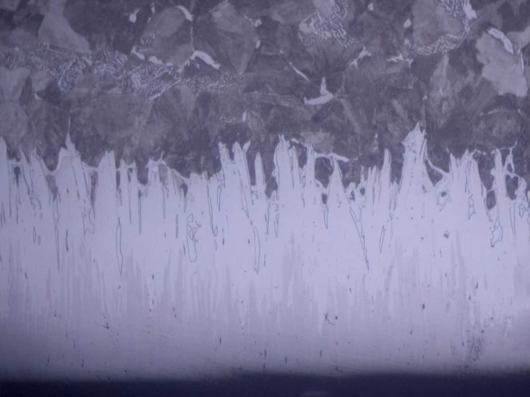 SEM cross-section of Fusion X treatment on S135 grade